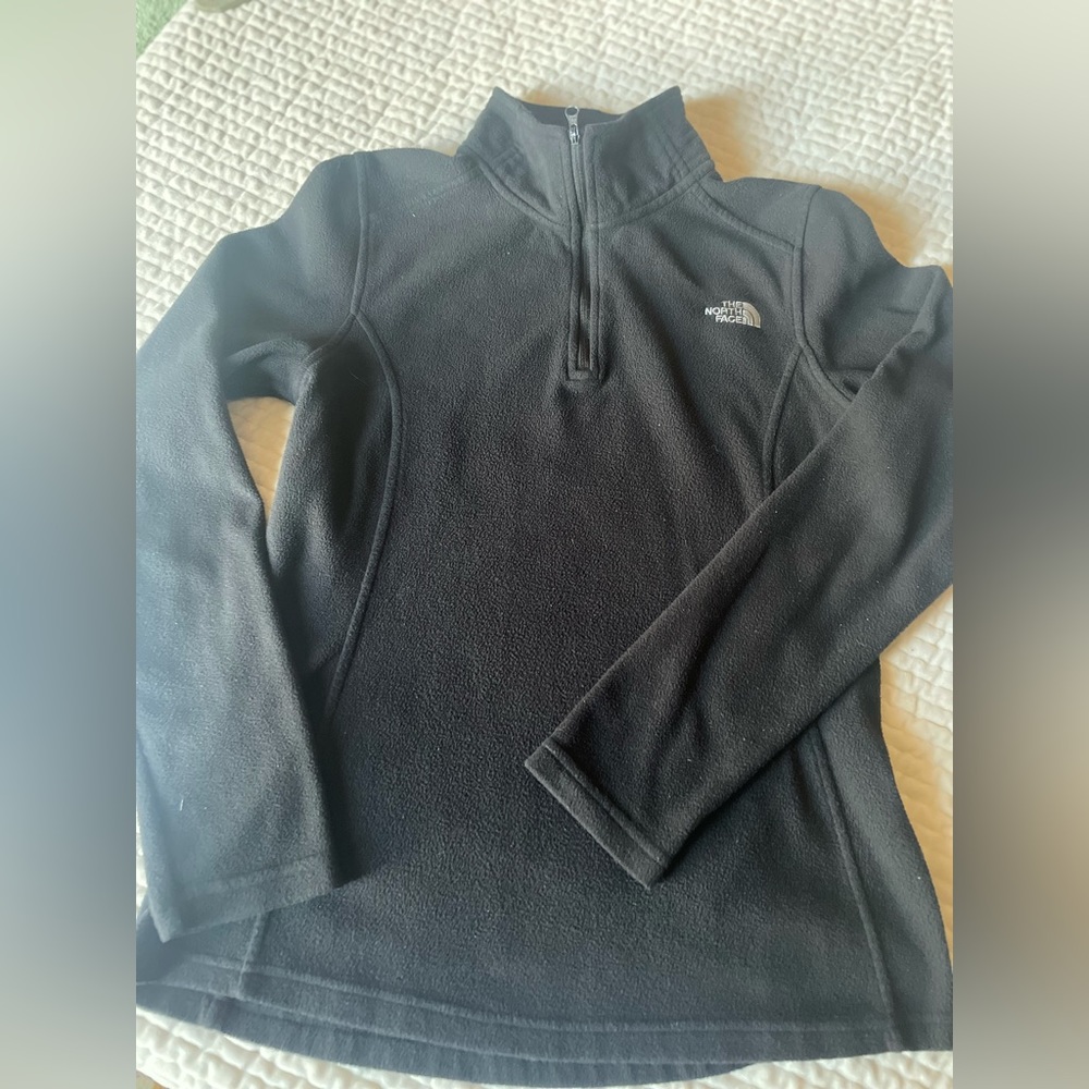 Black North face good condition sweater .